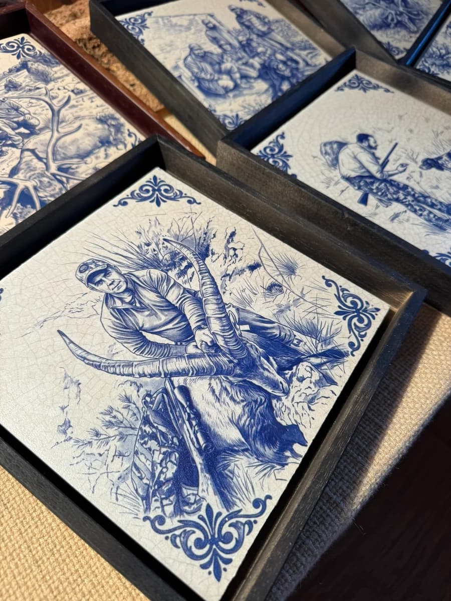 Custom tiles with hunting scenes in blue